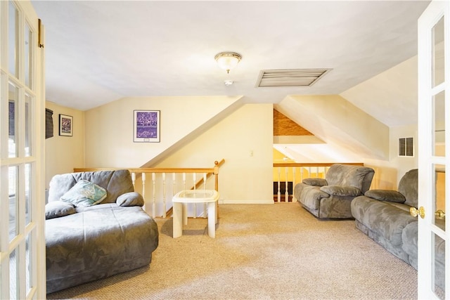 interior space with vaulted ceiling and visible vents