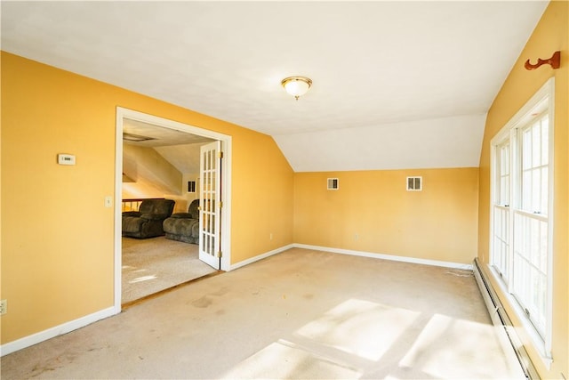 bonus room featuring visible vents, baseboards, carpet floors, lofted ceiling, and baseboard heating