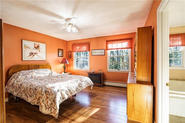 bedroom with ceiling fan, a baseboard radiator, baseboards, and hardwood / wood-style floors