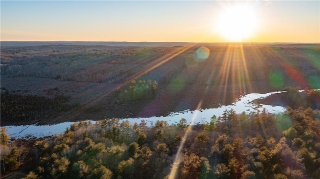 aerial view at dusk with a water view