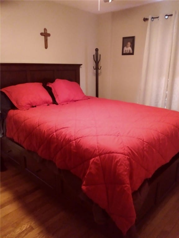 bedroom with wood finished floors