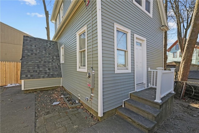 view of home's exterior with fence