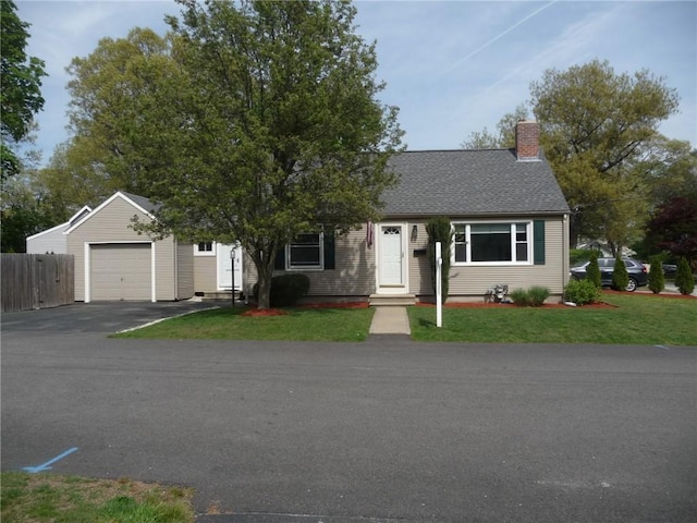 22 Kendall Ln, Warwick, RI 02888 - view of front of home featuring a garage, a front lawn, fence, a chimney, and driveway