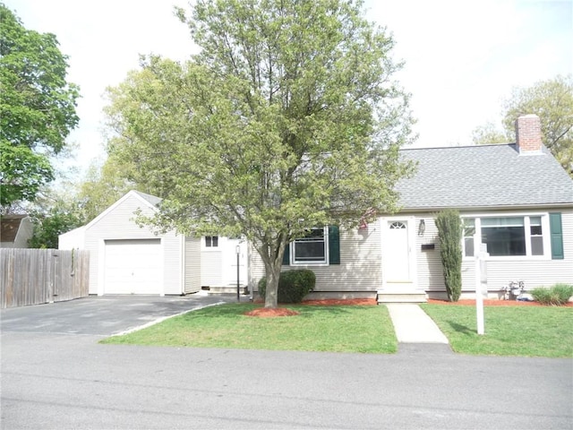22 Kendall Ln, Warwick, RI 02888 - view of front of property featuring fence, a chimney, a front yard, and aphalt driveway