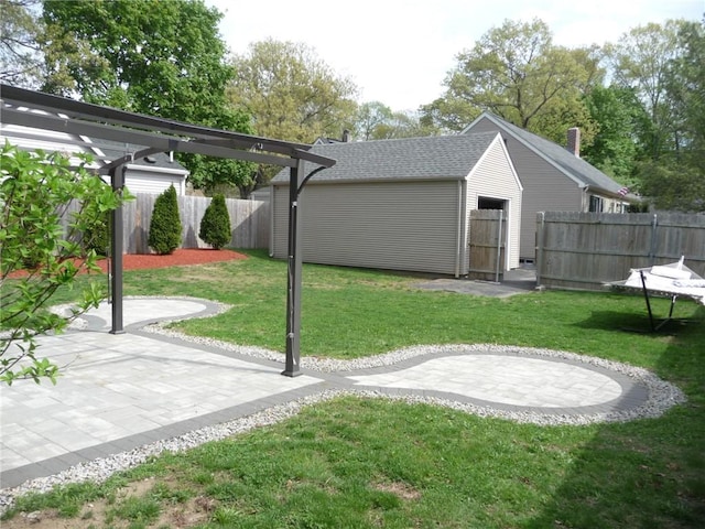 22 Kendall Ln, Warwick, RI 02888 - view of yard featuring fence, an outbuilding, and a patio area