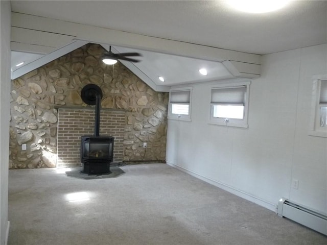 22 Kendall Ln, Warwick, RI 02888 - unfurnished living room featuring carpet flooring, ceiling fan, baseboard heating, a wood stove, and beamed ceiling