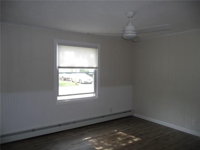 22 Kendall Ln, Warwick, RI 02888 - spare room featuring ornamental molding, wood finished floors, baseboard heating, a wainscoted wall, and a ceiling fan