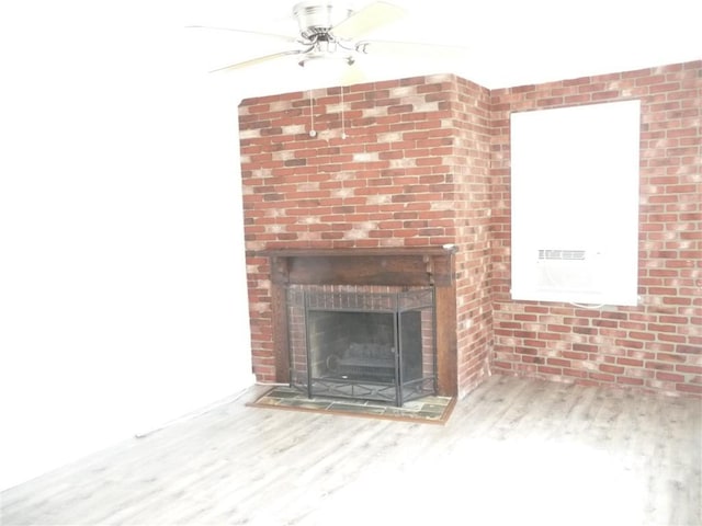 22 Kendall Ln, Warwick, RI 02888 - interior details featuring a brick fireplace, wood finished floors, and ceiling fan