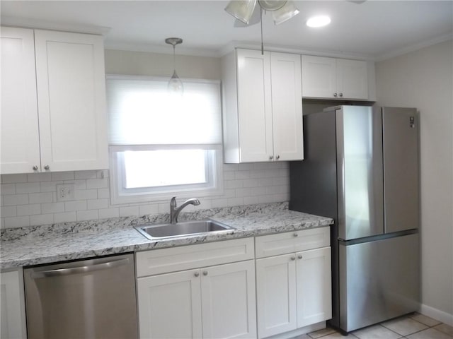 22 Kendall Ln, Warwick, RI 02888 - kitchen with ornamental molding, white cabinetry, a sink, appliances with stainless steel finishes, and backsplash