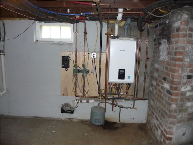 22 Kendall Ln, Warwick, RI 02888 - utility room featuring tankless water heater