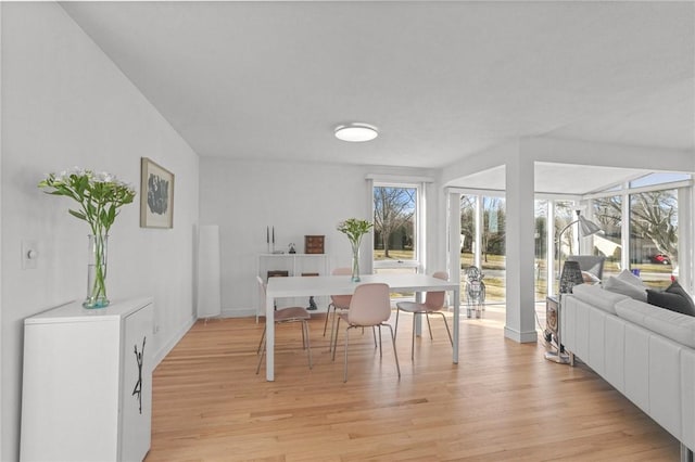 dining room with light wood-style flooring