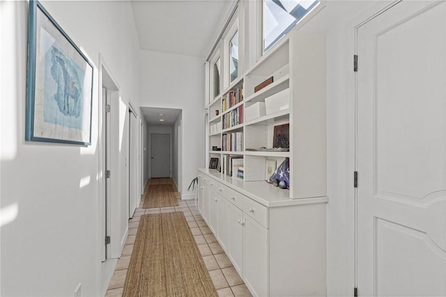 hall with light tile patterned flooring