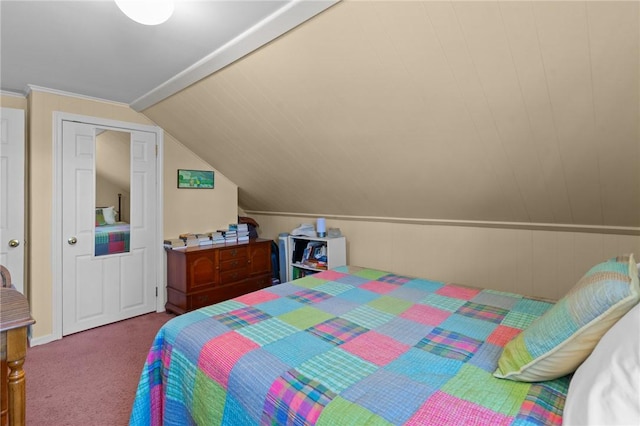 carpeted bedroom featuring lofted ceiling