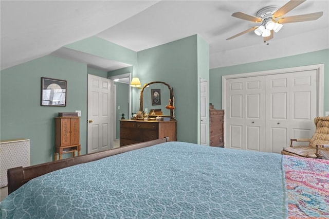 bedroom with a closet, radiator heating unit, ceiling fan, and vaulted ceiling