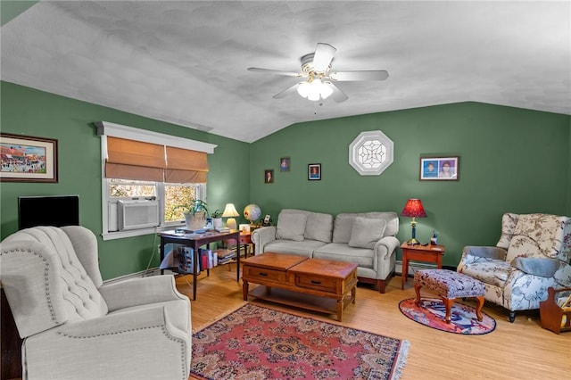 living room with lofted ceiling, plenty of natural light, wood finished floors, and cooling unit