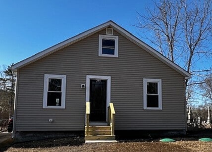 rear view of house with entry steps