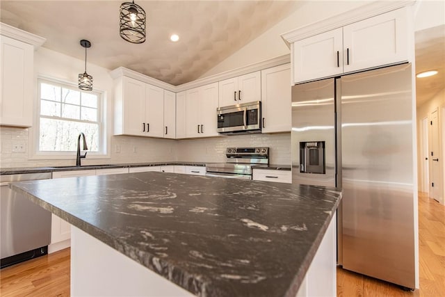 kitchen featuring a sink, white cabinets, and stainless steel appliances