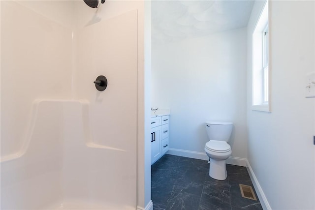 bathroom with a shower, visible vents, baseboards, toilet, and vanity