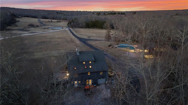 aerial view at dusk with a rural view