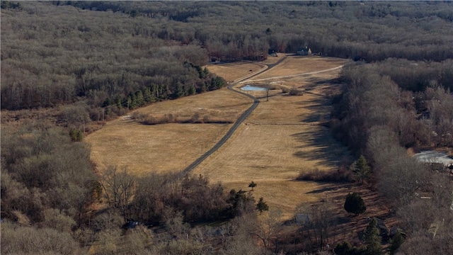 drone / aerial view with a forest view and a rural view