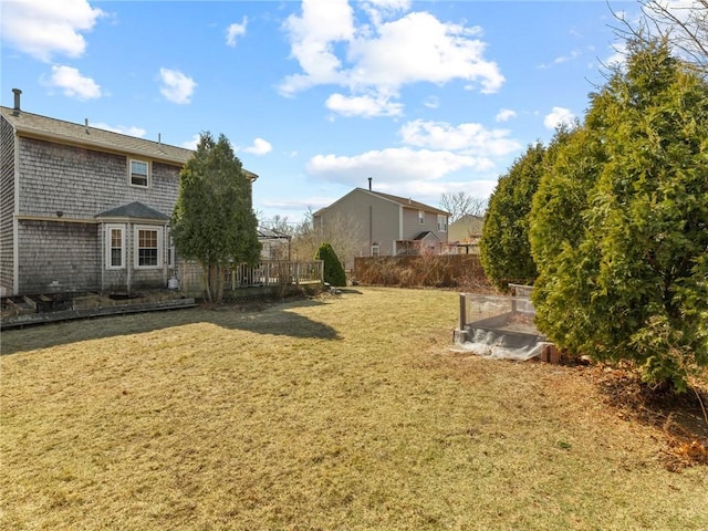 view of yard with a wooden deck