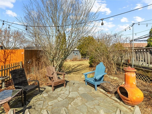 view of patio / terrace featuring fence