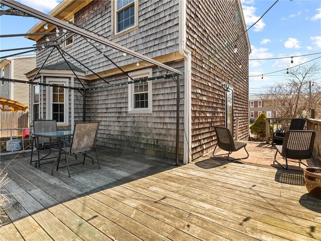 wooden deck with outdoor dining space