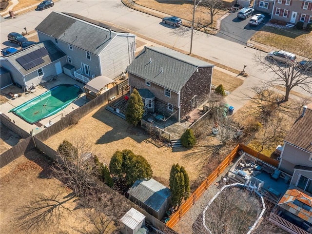 birds eye view of property with a residential view