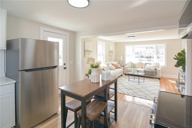 dining room featuring light wood-style floors