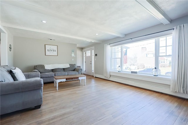 living area with beamed ceiling, visible vents, wood finished floors, recessed lighting, and baseboards