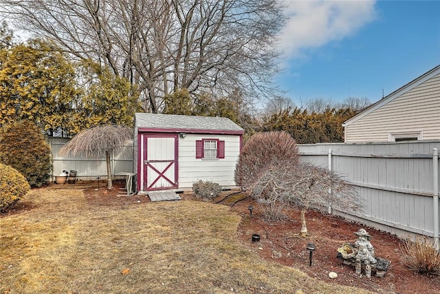 view of shed featuring a fenced backyard