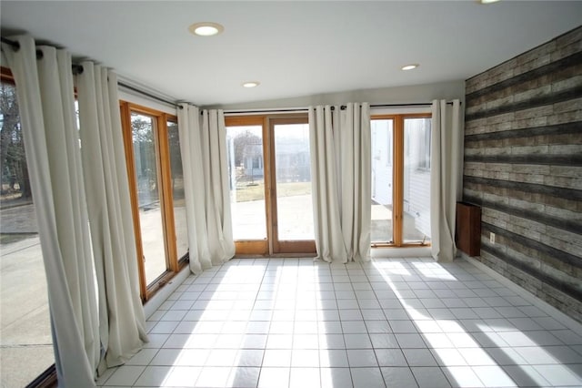 interior space featuring recessed lighting and wood walls