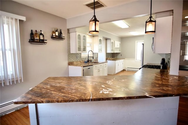 kitchen featuring a sink, white cabinetry, stainless steel dishwasher, and gas stove