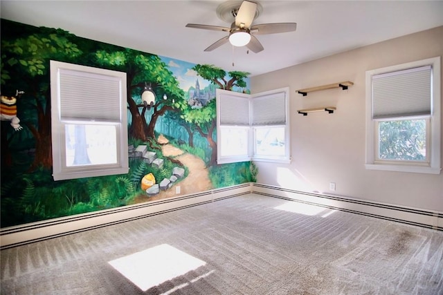 carpeted empty room with a ceiling fan