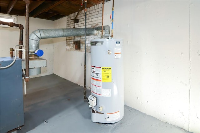 utility room with gas water heater and a heating unit