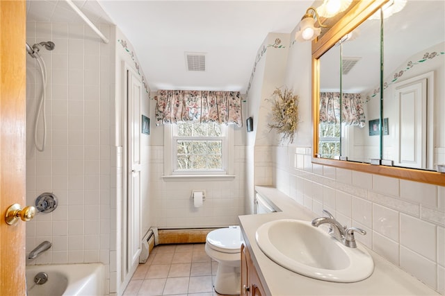 bathroom featuring visible vents, a baseboard radiator,  shower combination, tile patterned flooring, and tile walls