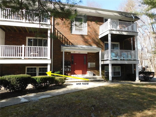 view of front of home with brick siding