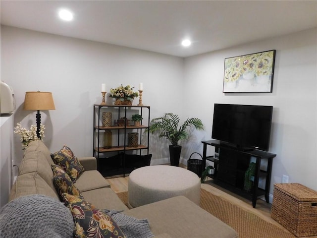 living room with recessed lighting and wood finished floors