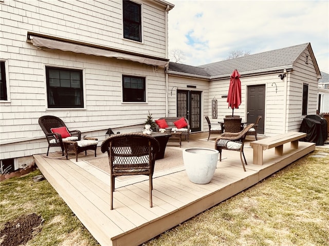 deck with grilling area and an outdoor hangout area