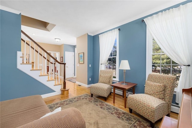 sitting room featuring stairs, parquet flooring, baseboards, and baseboard heating