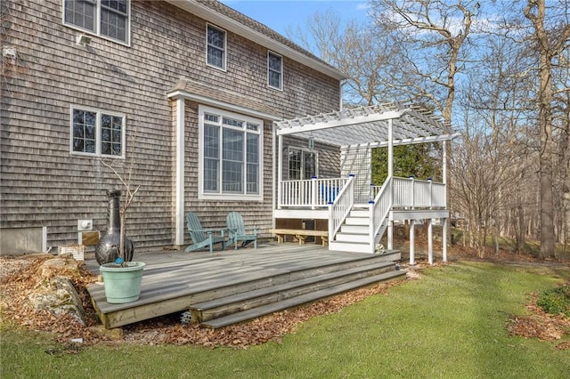 rear view of house featuring a yard, a deck, and a pergola