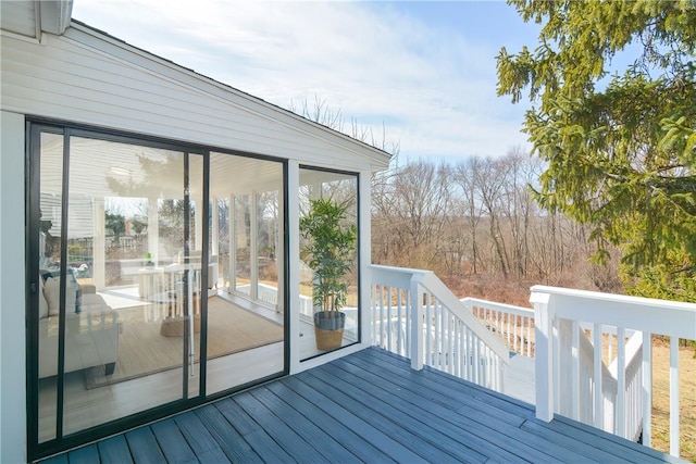 wooden deck featuring a sunroom