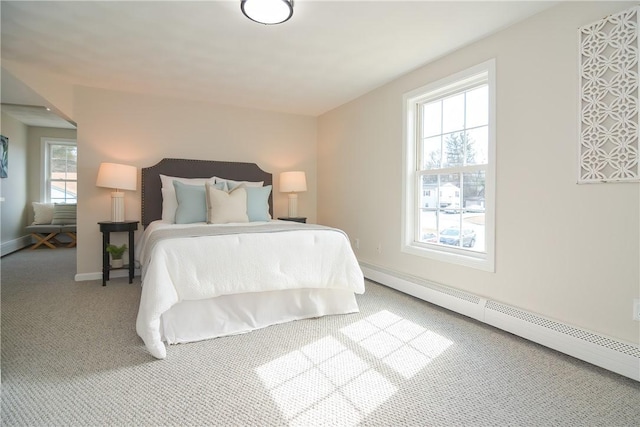 bedroom featuring carpet flooring, baseboards, and a baseboard radiator