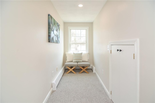 hallway featuring recessed lighting, baseboards, and carpet floors