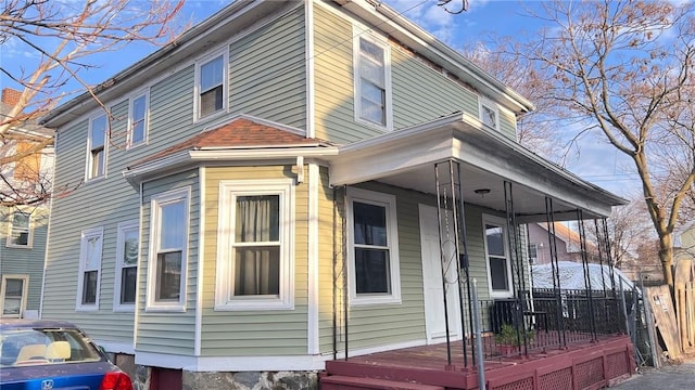 view of side of home featuring a porch