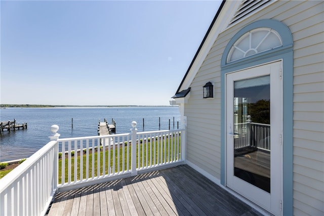 wooden terrace with a water view