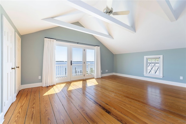 bonus room with baseboards, hardwood / wood-style floors, and vaulted ceiling