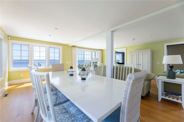 dining space with recessed lighting, visible vents, baseboards, and light wood-style floors