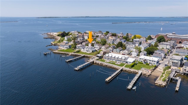 birds eye view of property with a water view and a residential view