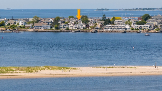 view of water feature with a residential view and a view of the beach